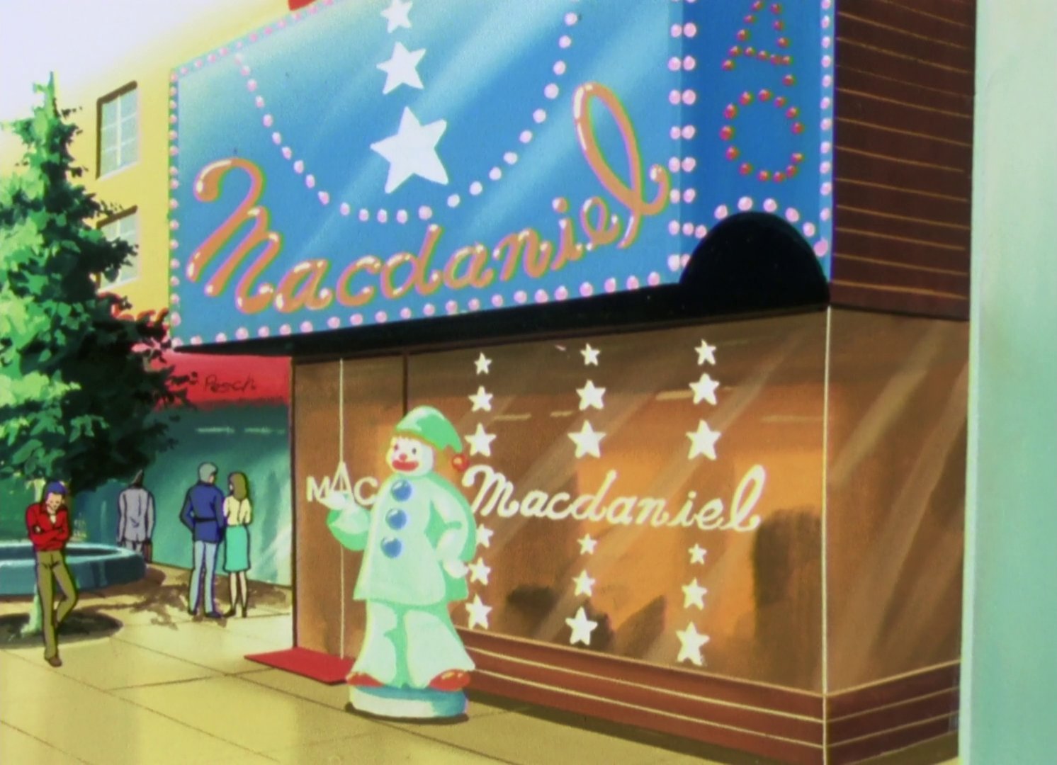 The storefront of MacDaniel, with a mint green clown statue outside it.