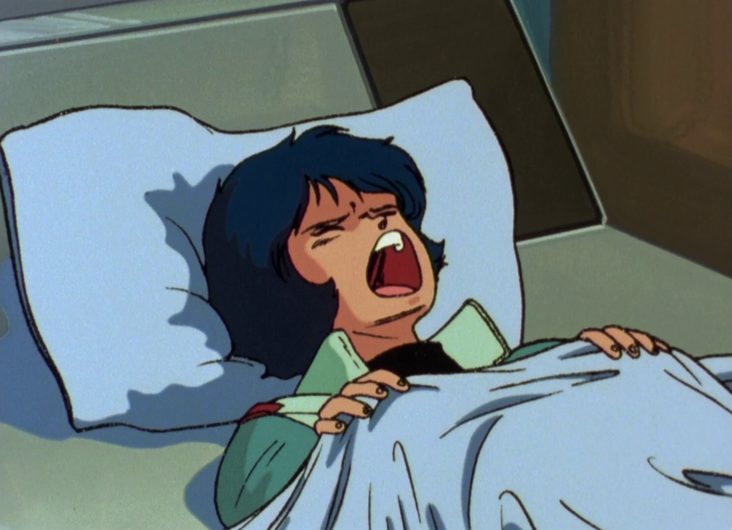 Kamille in bed in his uniform.