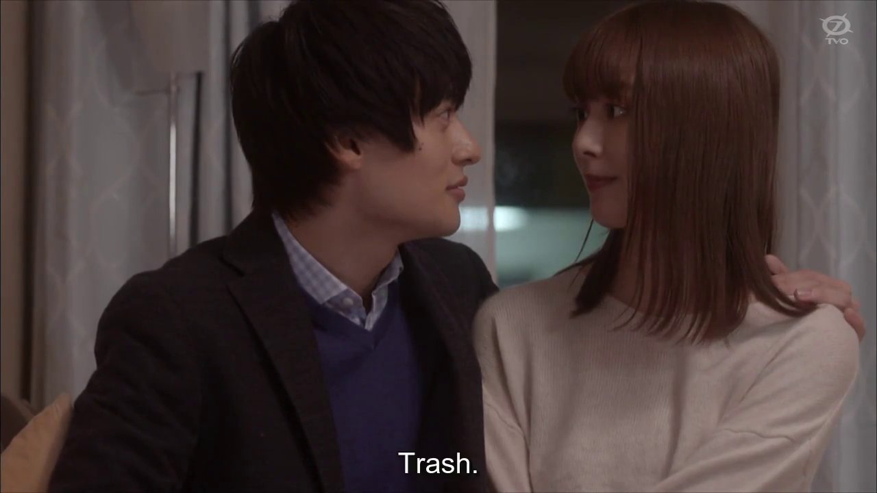 B-kun and Momoe, a woman with long brown hair, looking at each other.  Momoe thinking Trash.