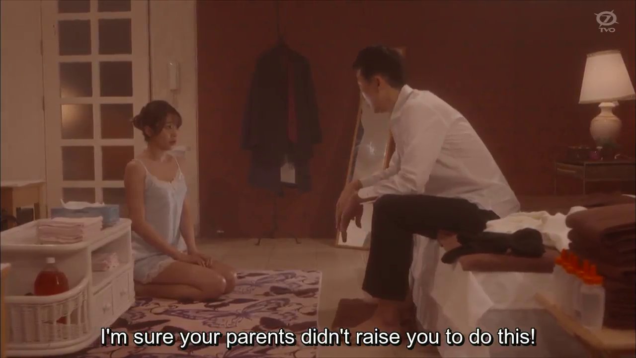 Kokoro, in white lingerie, knealing before a customer.  Customer: I'm sure your parents didn't raise you to do this.