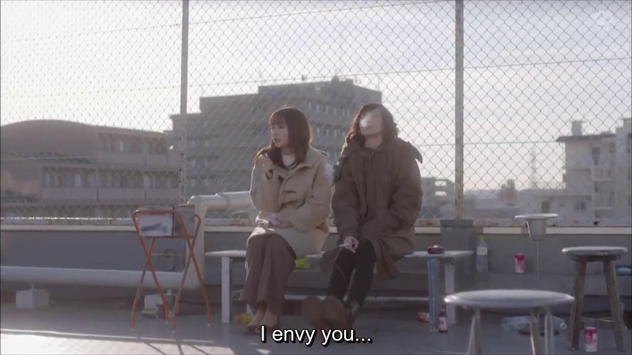 Momoe and Ume on a bench on the roof, Ume smoking.  Momoe: I envy you.