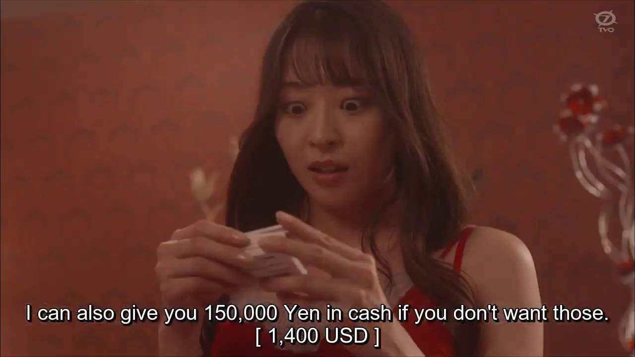 Kokoro, holding the cards.  Hiyama: I can also give you 150000 yen ($1400) in cash if you don't want those.