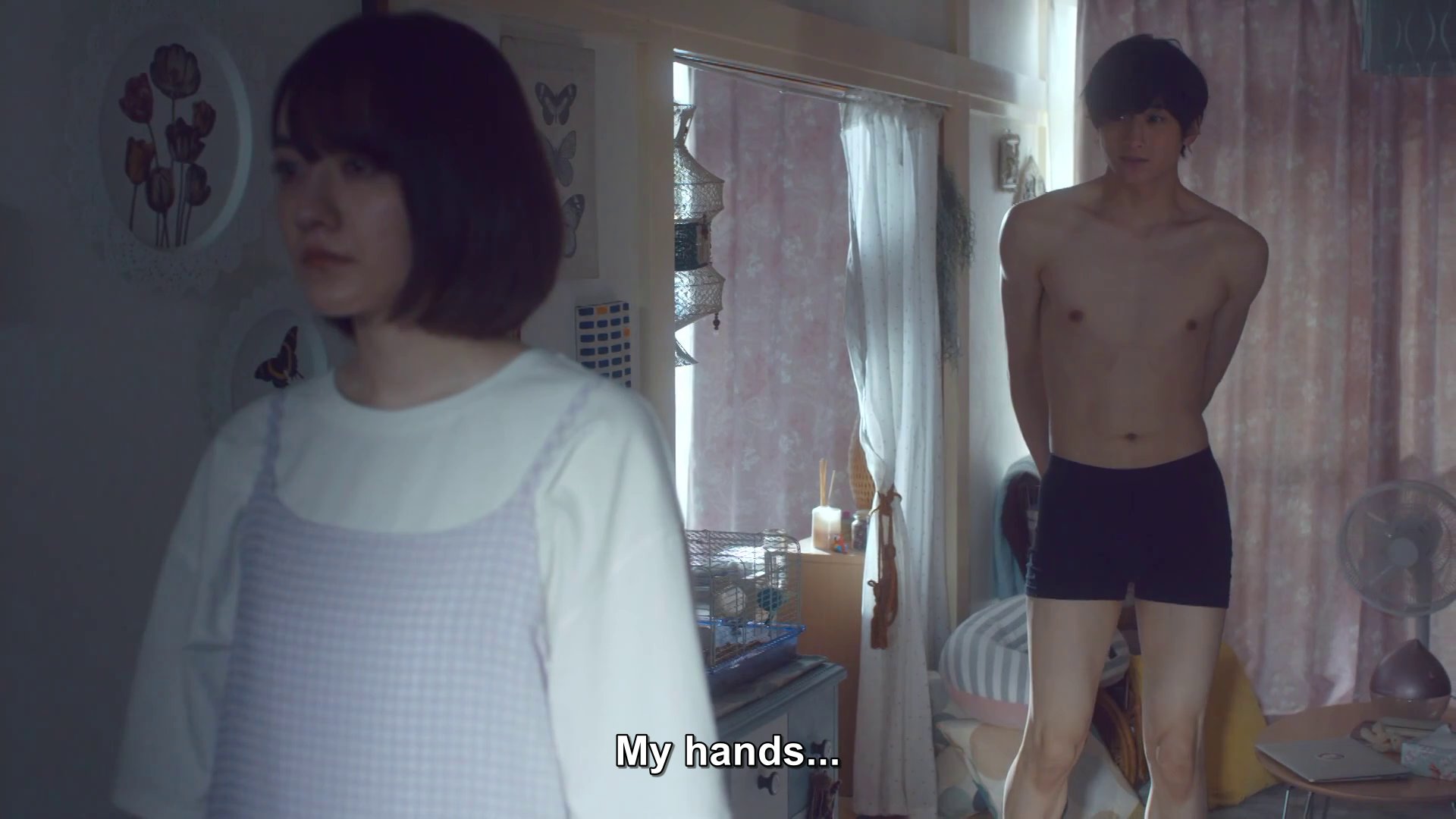 Matsuda, in his underwear, behind Ako, a woman with chin-length dark hair who is fully dressed.  Matsuda: My hands,
