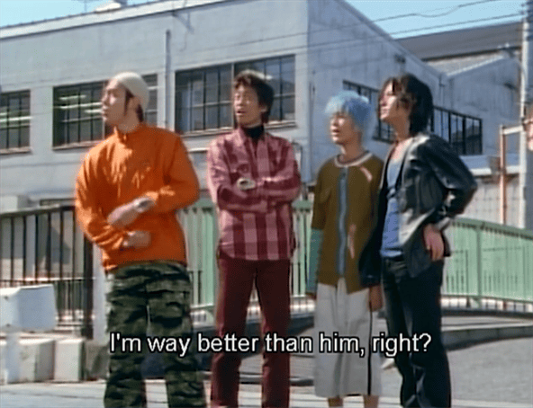 Tatsuya, Domon, Sion, and Ayase standing outside.  Ayase is a man with longish hair and dressed in black.  Domon: I'm way better than him, right?