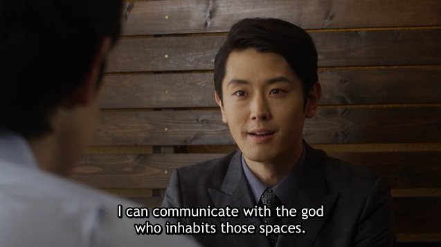 Fukuide Kei, a man in a dark suit with neat hair: I can communicate with the god who inhabits those spaces.