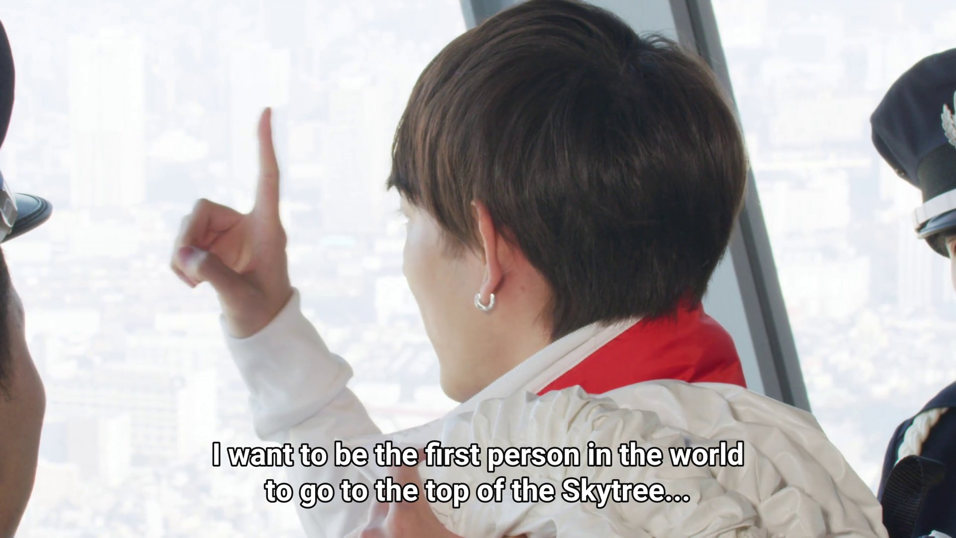 Kaito, a young man with short hair and a horseshoe earring.  Kaito: I want to be the first person in the world to go to the top of the Skytree.