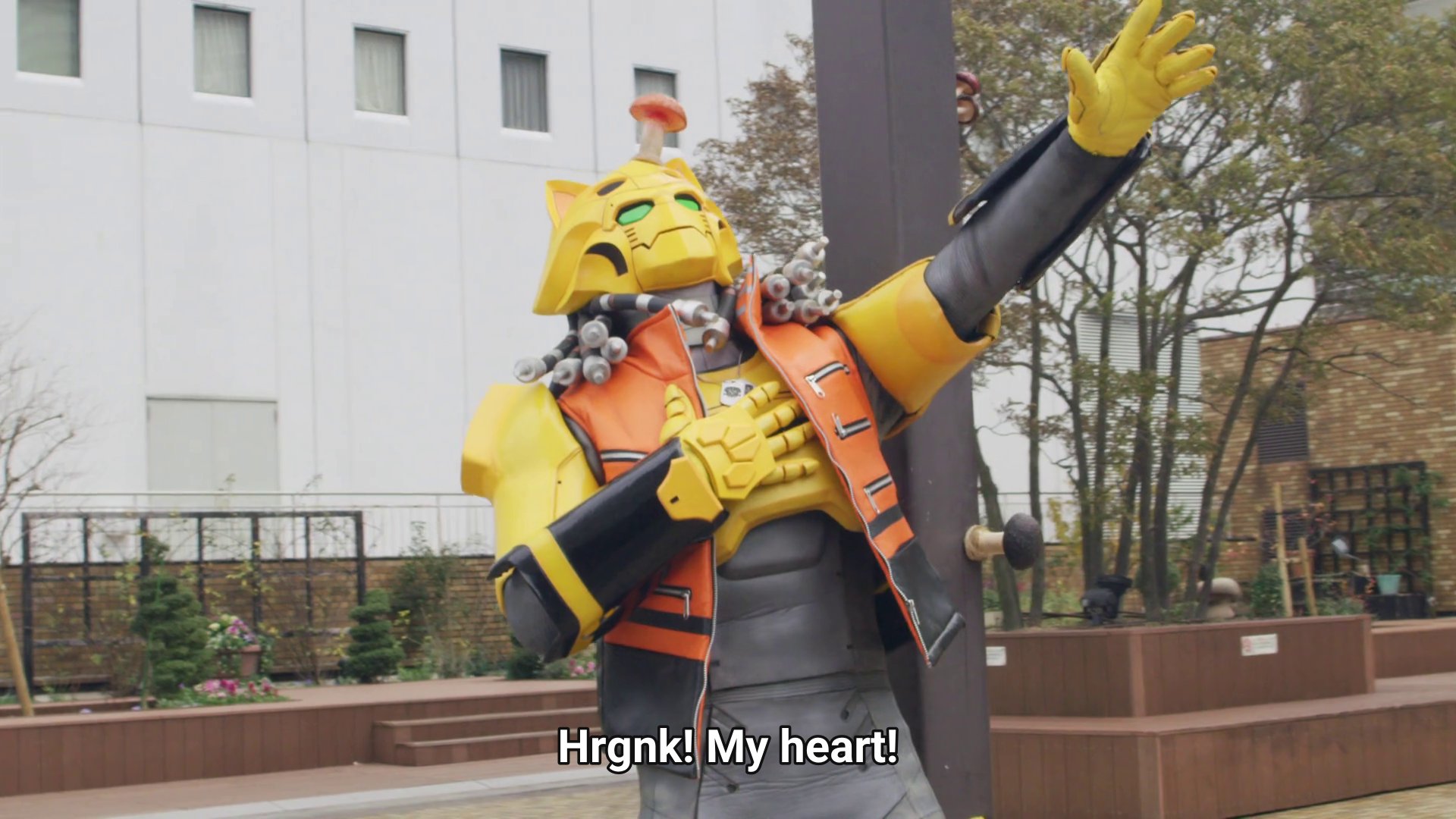 Gaon, a yellow kitty robot with a vest jacket and cable dreads: Hrgnk! My heart!